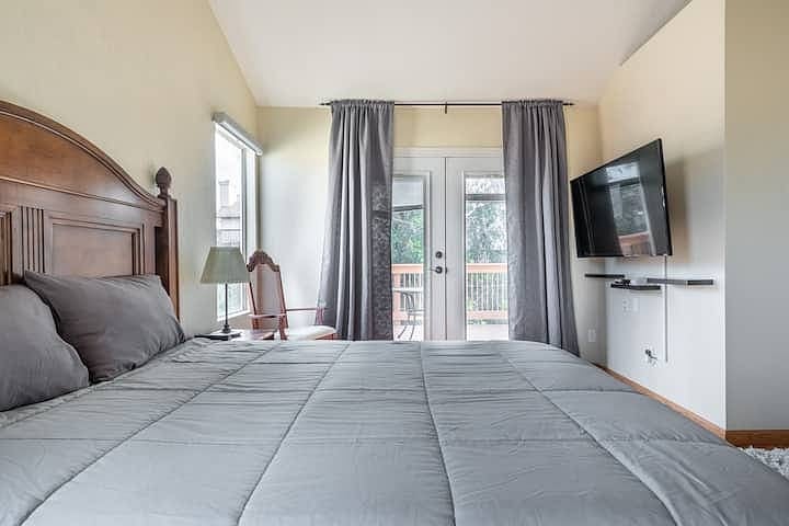 Primary suite has its own television and French doors accessing its own private balcony.