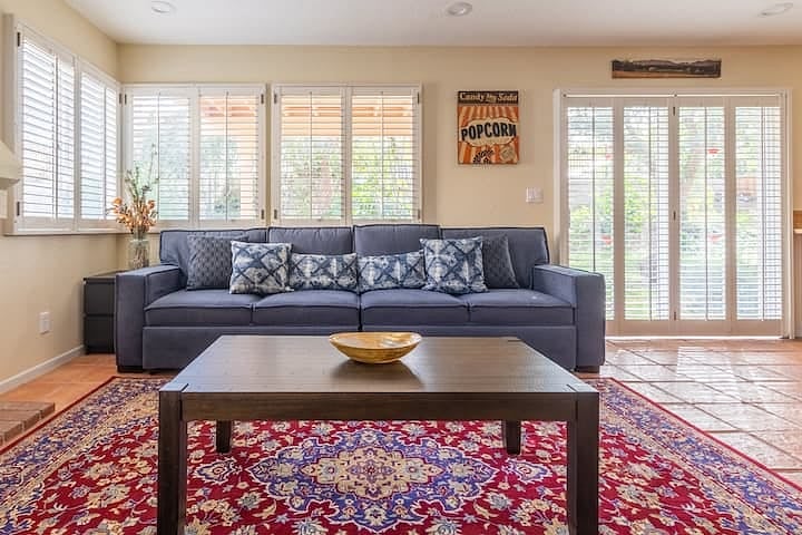 The entertainment area provides comfortable lounging and easy access to the back yard.