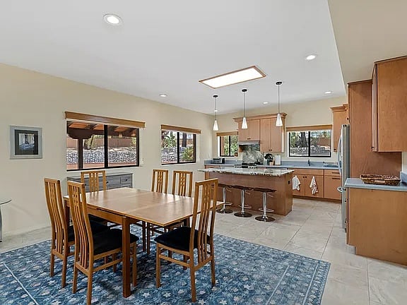 Dining room with kitchen in background