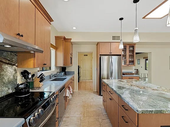 Kitchen with full stove and microwave