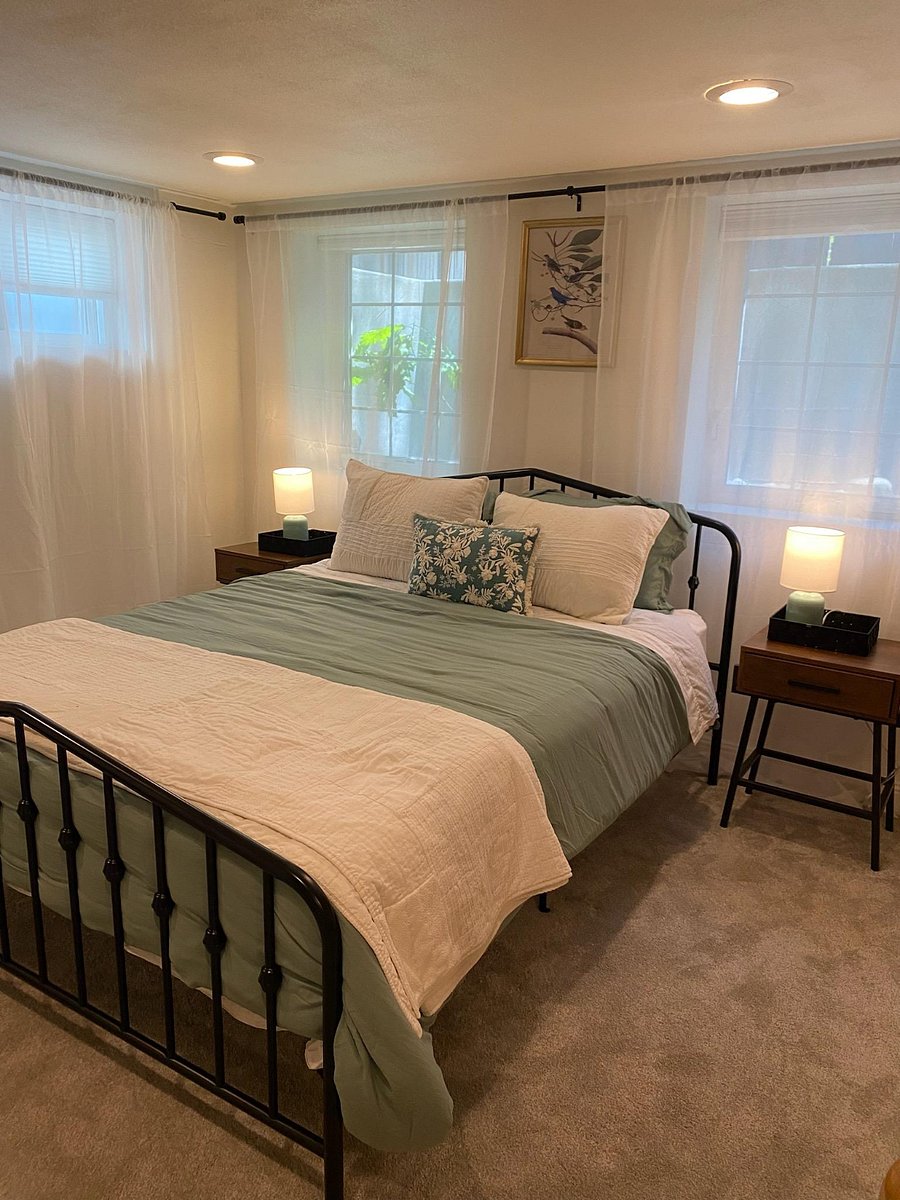 The cozy downstairs queen with bathroom featuring a shower and laundry room..