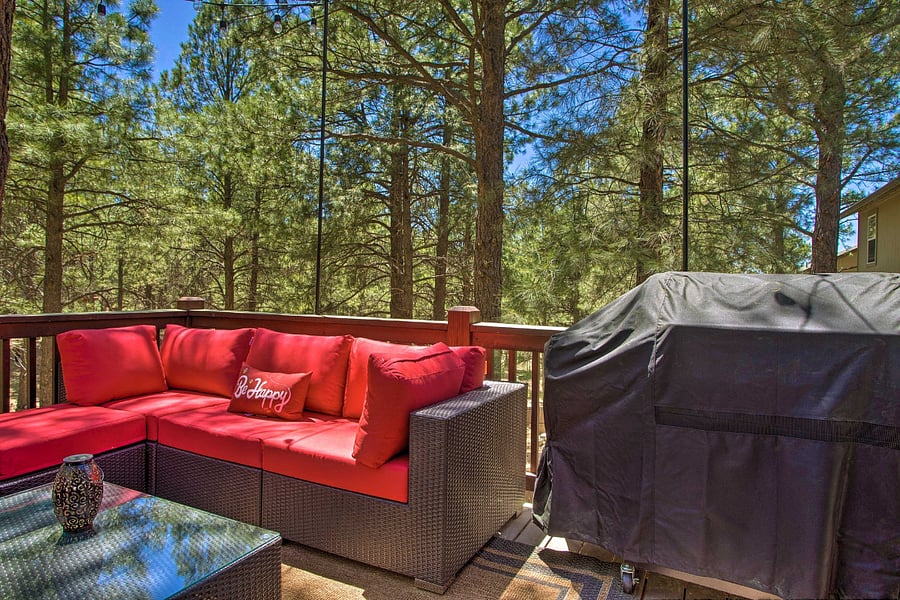 Deck off of dining area with outdoor furniture and grill