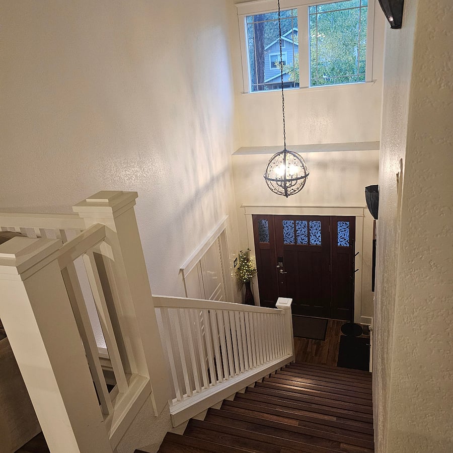 Front door, entryway, and stairway to upstairs
