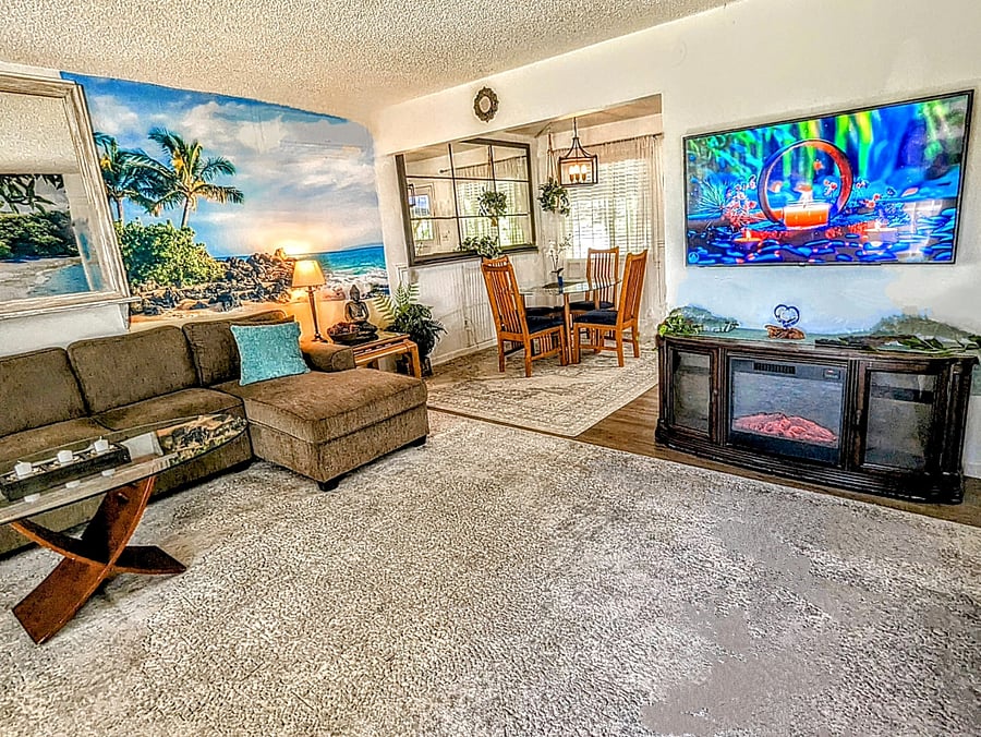 Open concept living room has Maui theme (owner is from Maui )