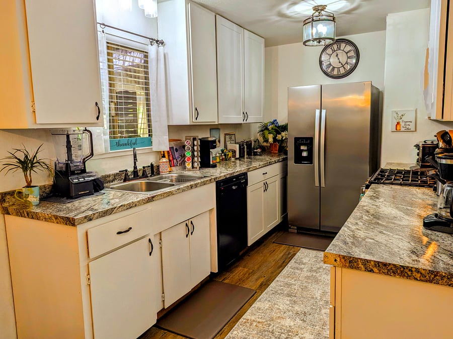 Galley kitchen has new appliances and many other amenities, including many different ways to make coffee!