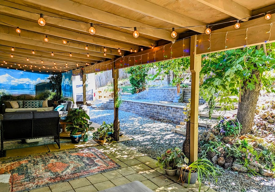 Backyard patio with lots of trees