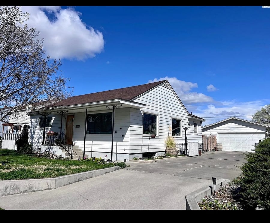 Front yard for guests, entry is on right/south side of house