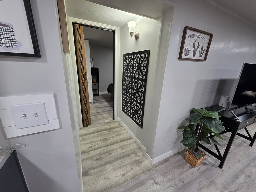 Hall to bedroom, bathroom to left