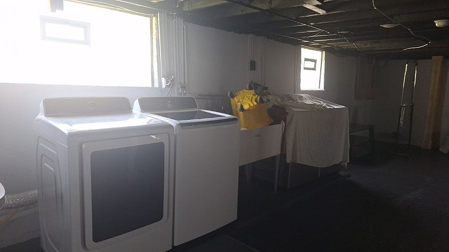 Upper apt washer and dryer located in the basement.