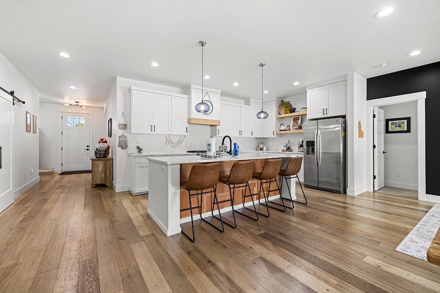 Open concept living! Gorgeous, fully equipped kitchen with all the cooking, baking and dining supplies you will need. Kitchen Aid appliances, quartz countertops and full-size refrigerator.
