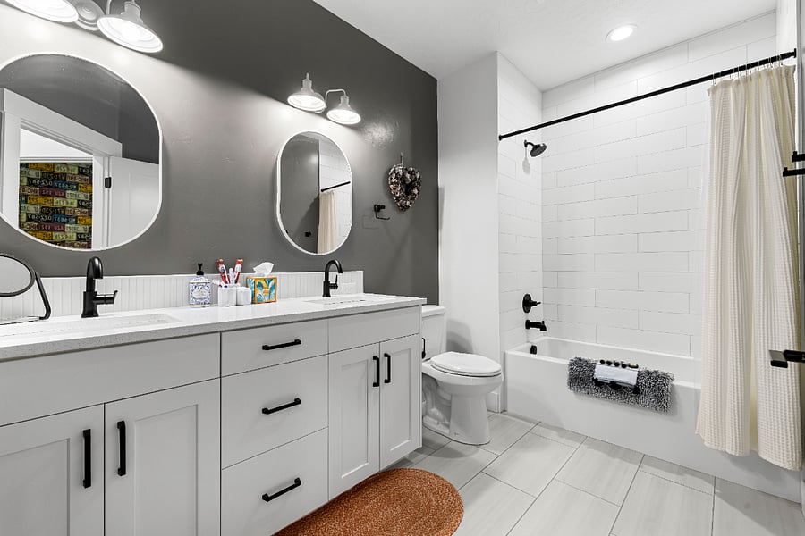 Large guest bathroom with deep tub and double sink vanity. Plenty of storage for your items.