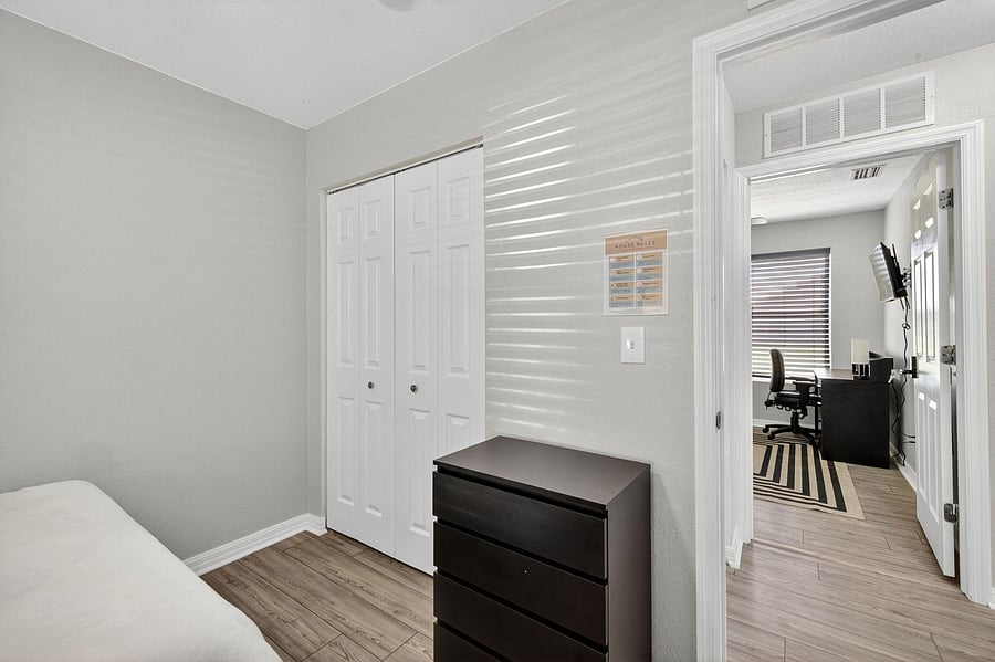 Bedroom 1 featuring the closet & dresser