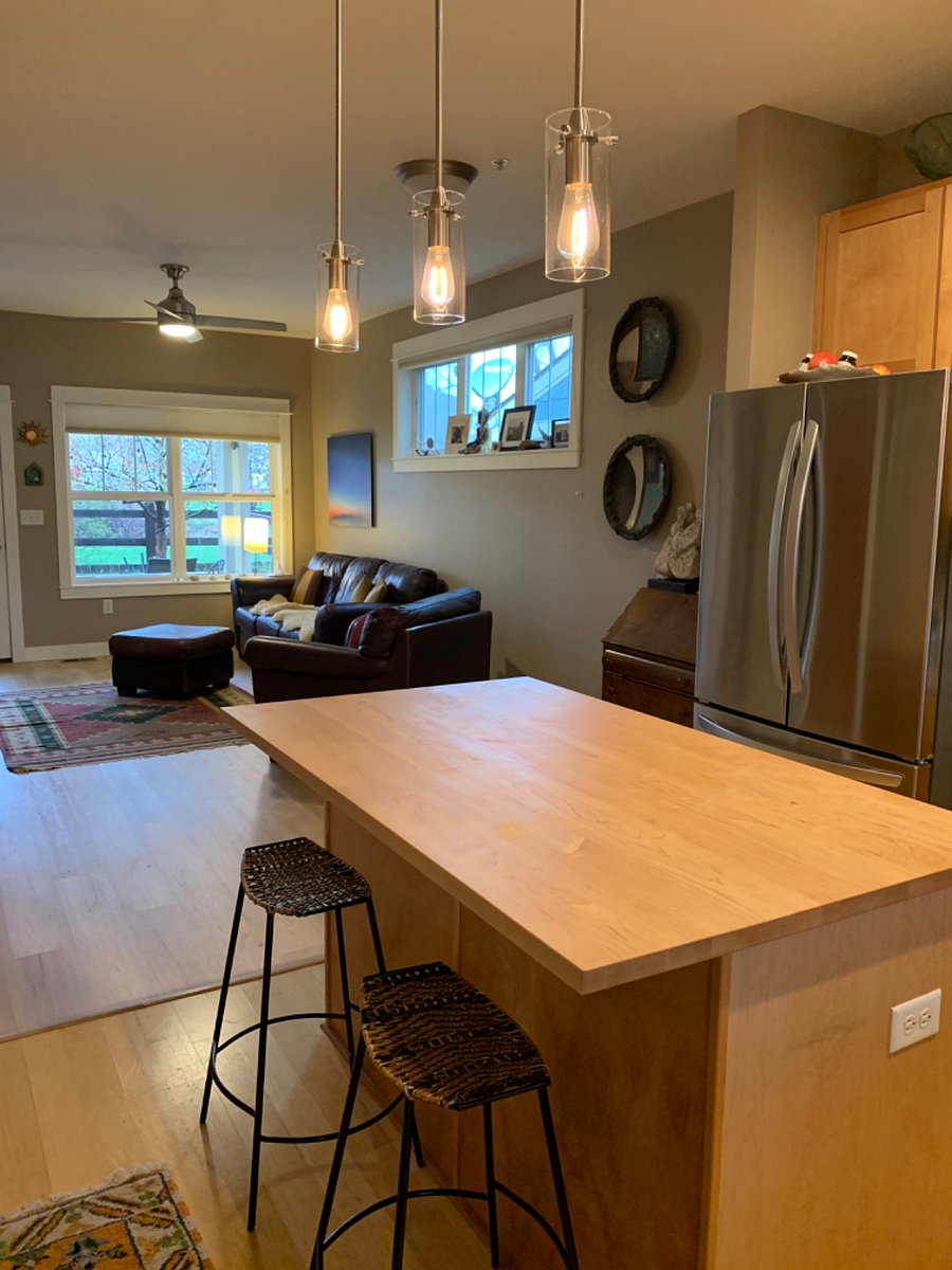 Kitchen island, this is no longer wood and is white quartz. 