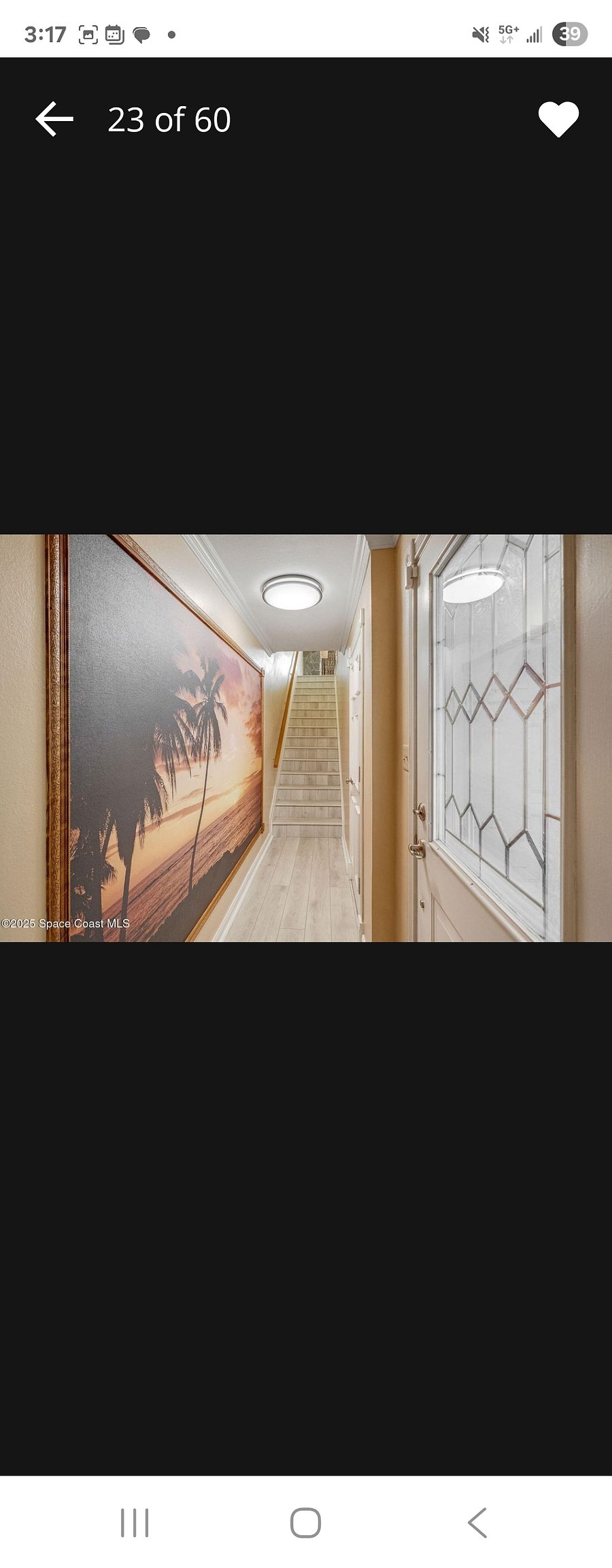 Entrance hallway. Enter from the front door or the garage door. Walk up stairs to the main/second floor.