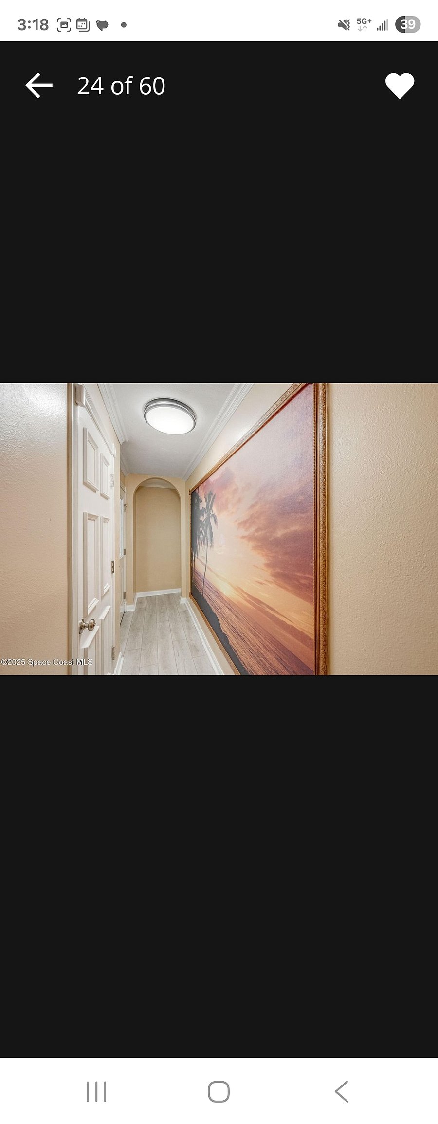 Coming down from the 2nd floor facing the front door entrance : First door is the garage door and beyond is the front door that leads outside to the driveway. Across from the front door is the full wall mural.