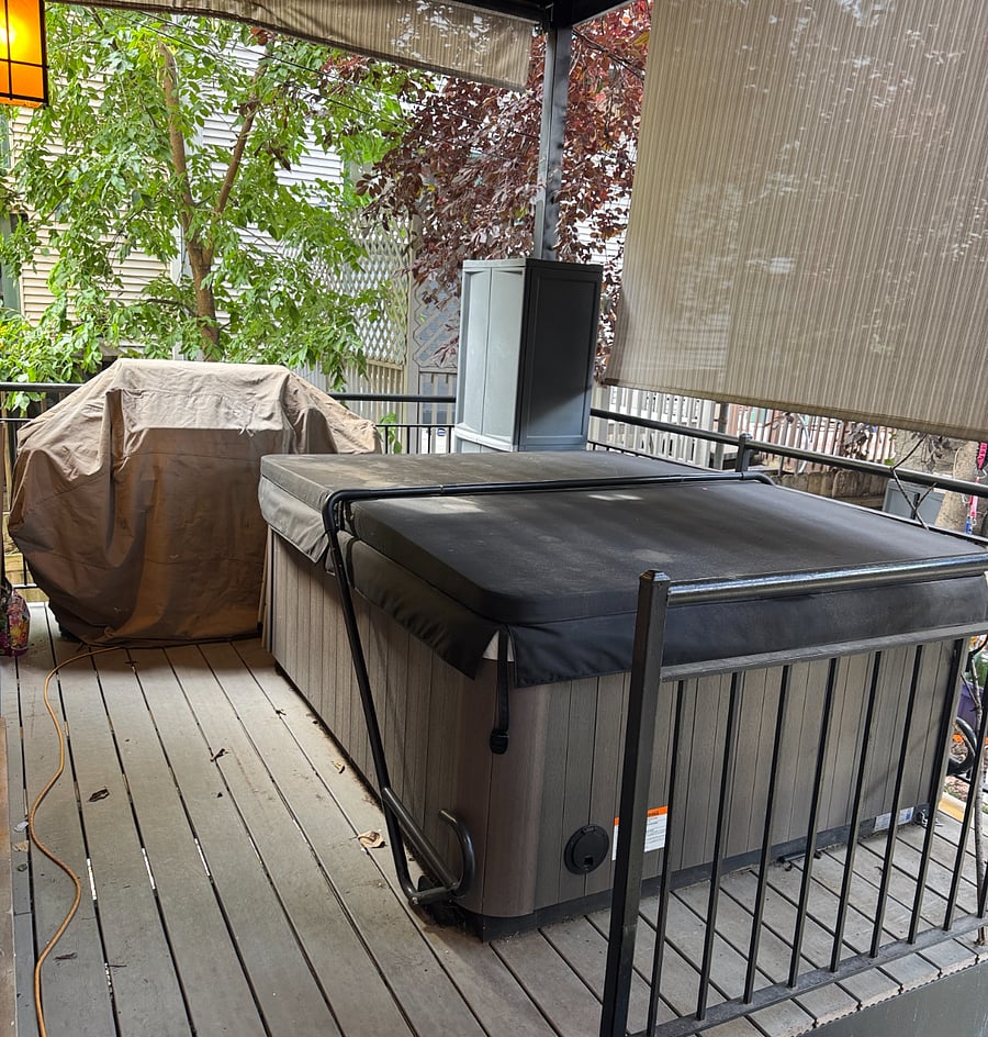 4 person hot tub and on back deck off of master.