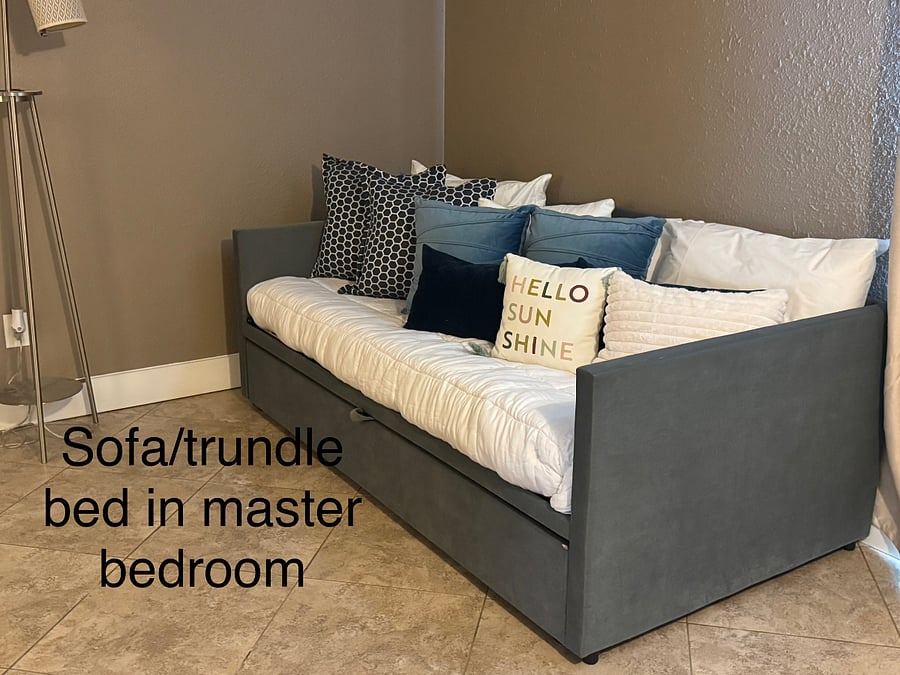 This is a trundle bed that can sleep two more people on the twin beds. Also can be used as a sofa for lounging.