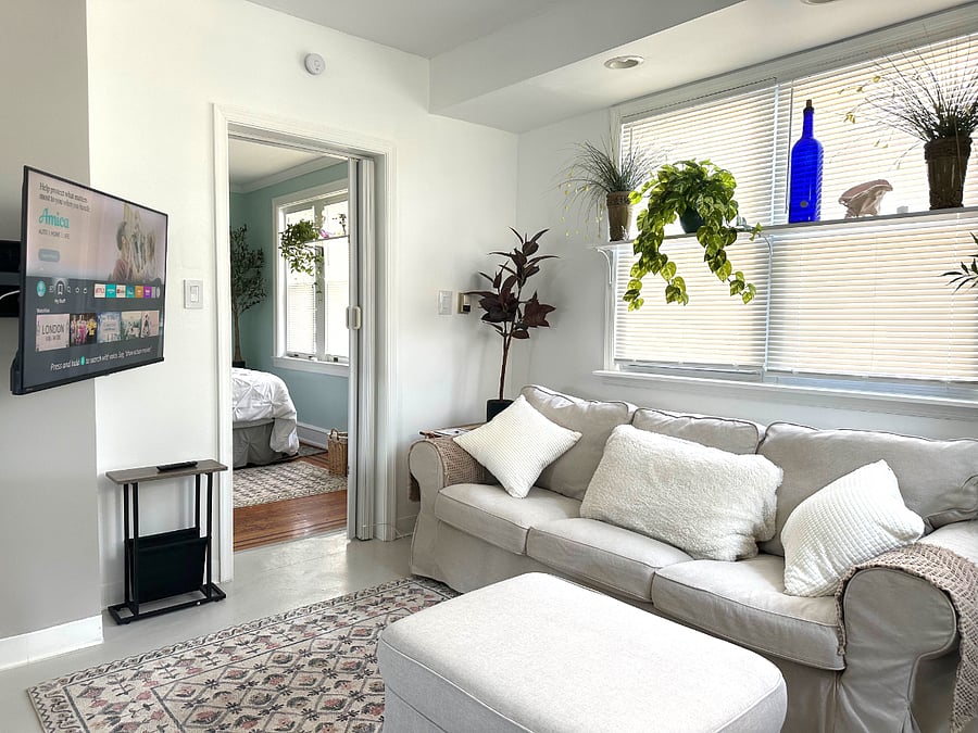 Your Living Room Area. The Smart TV (shown on the left) is easily rotated for comfortable viewing on the sofa, or in the dining area.