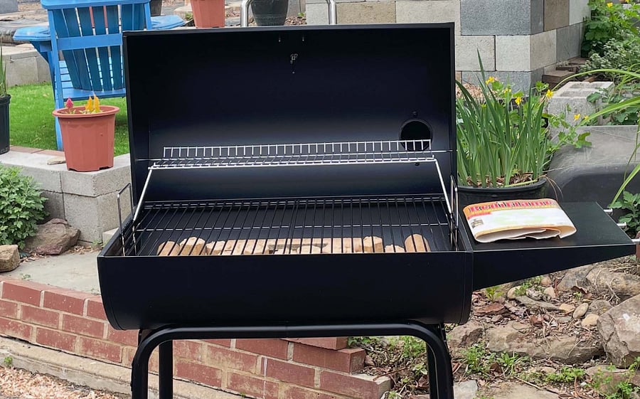 Barbecue Grill with utensils.
Please purchase your own charcoal and lighter fluid.