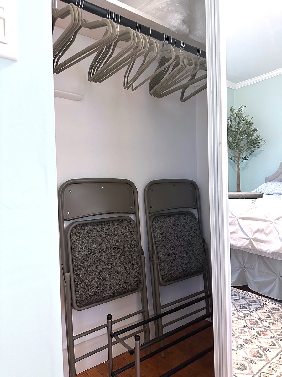 Two padded folding chairs.