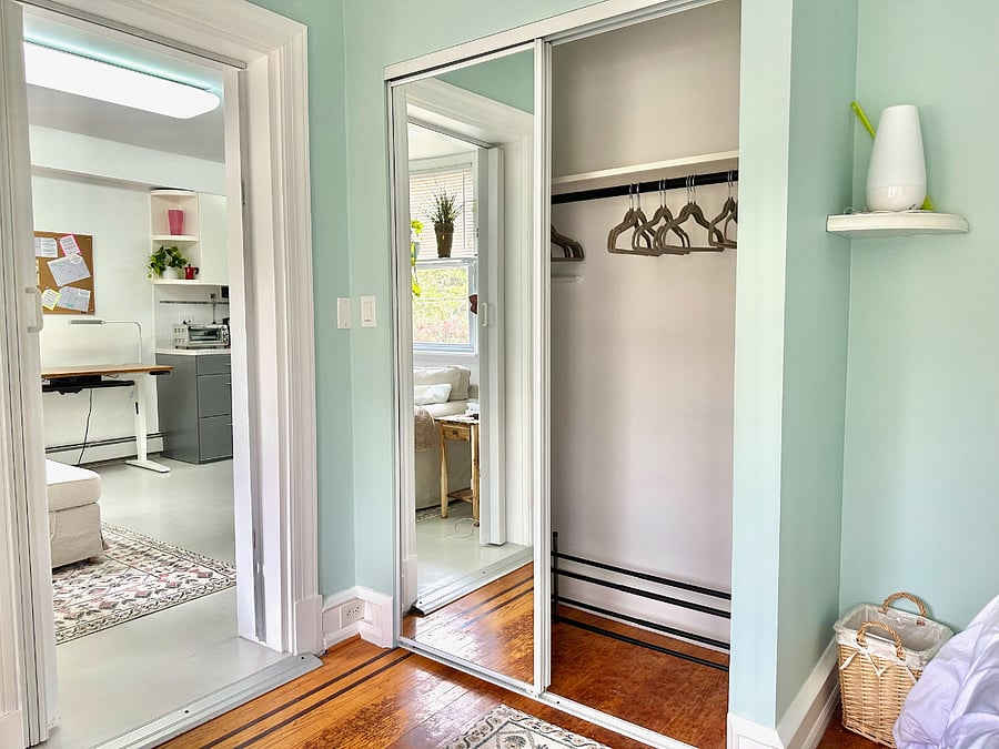Full closet, with storage shelf above, plenty of hangers, and full length mirror sliding door.