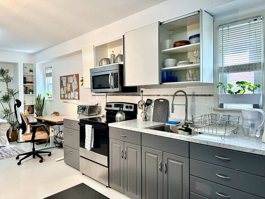 The dedicated work area is to the left of the kitchen.