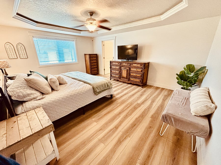 Large Master bedroom with King Bed and oversized tub and Shower