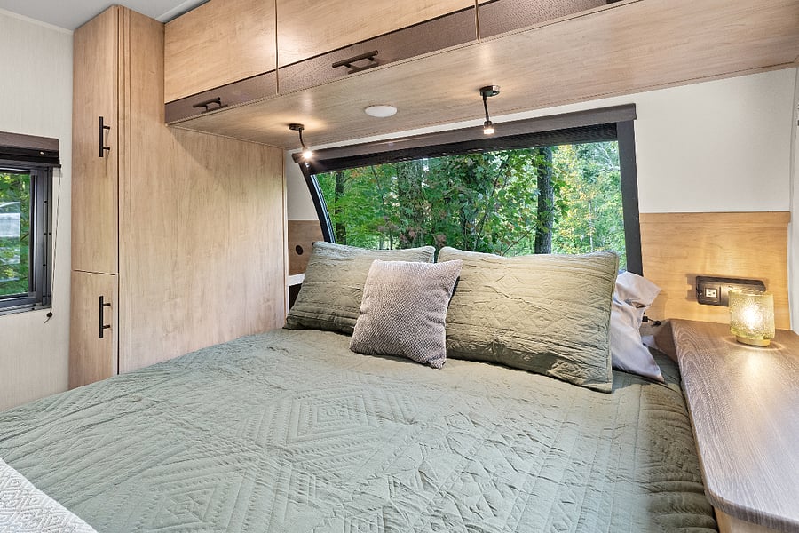 Queen size bed with bamboo mattress pad; charging ports available for USB, phone, etc