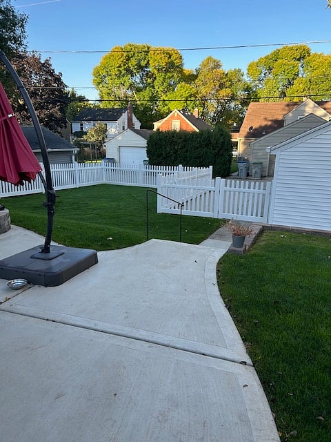 Back yard with parking spot.