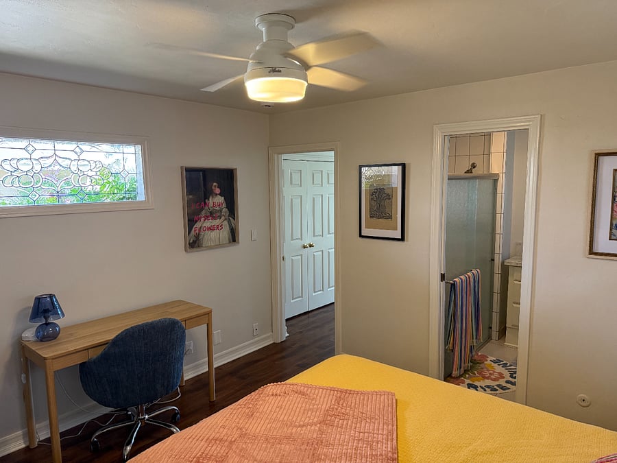 Cozy bedroom with queen bed and workspace