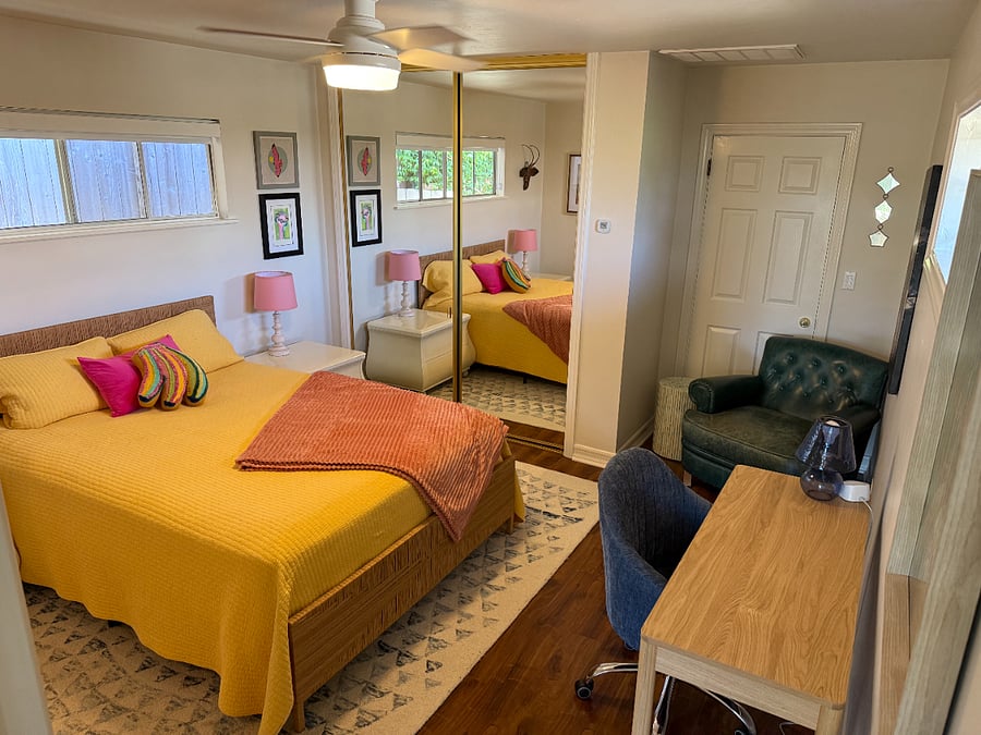 Cozy bedroom with queen bed and workspace