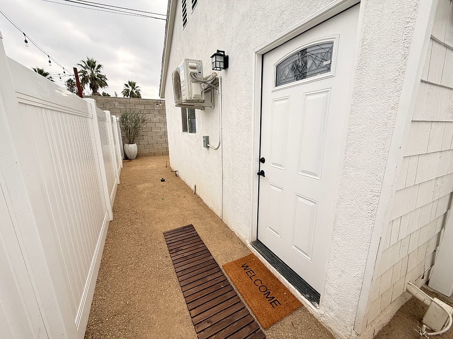 Entrance to ADU with pathway to private backyard courtyard
