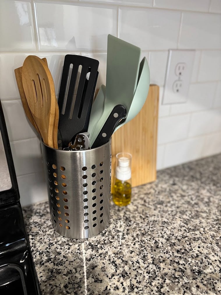 cooking utensils, can opener, small cutting board, knife
