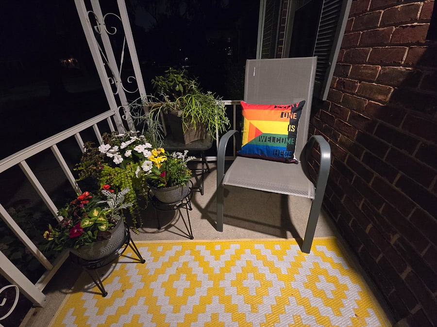 Front porch. 1 chair, 1 glider. Seasonal decor. LGBTQIA Friendly home.