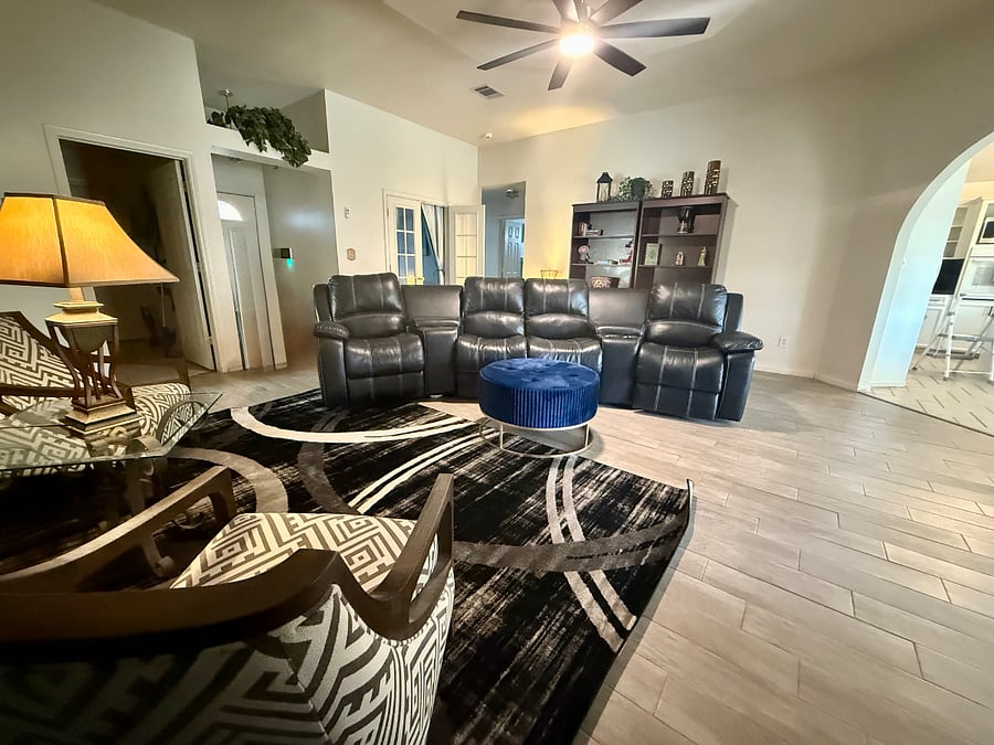 Looking at living room with front door behind.