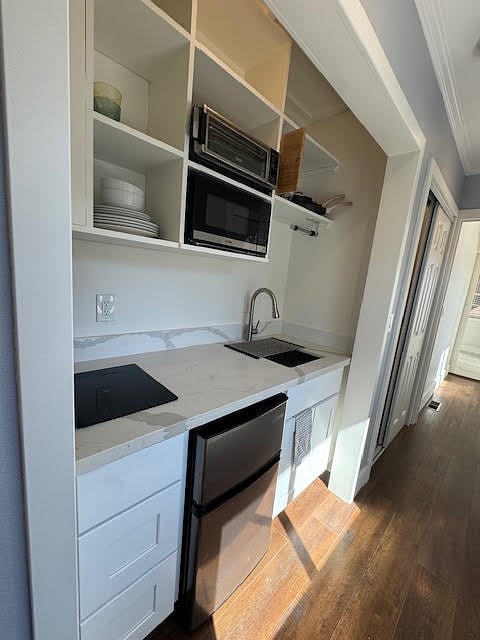 Microwave, air fryer, new sink with garbage disposal, new fridge and freezer. Fan over the convection stovetop.