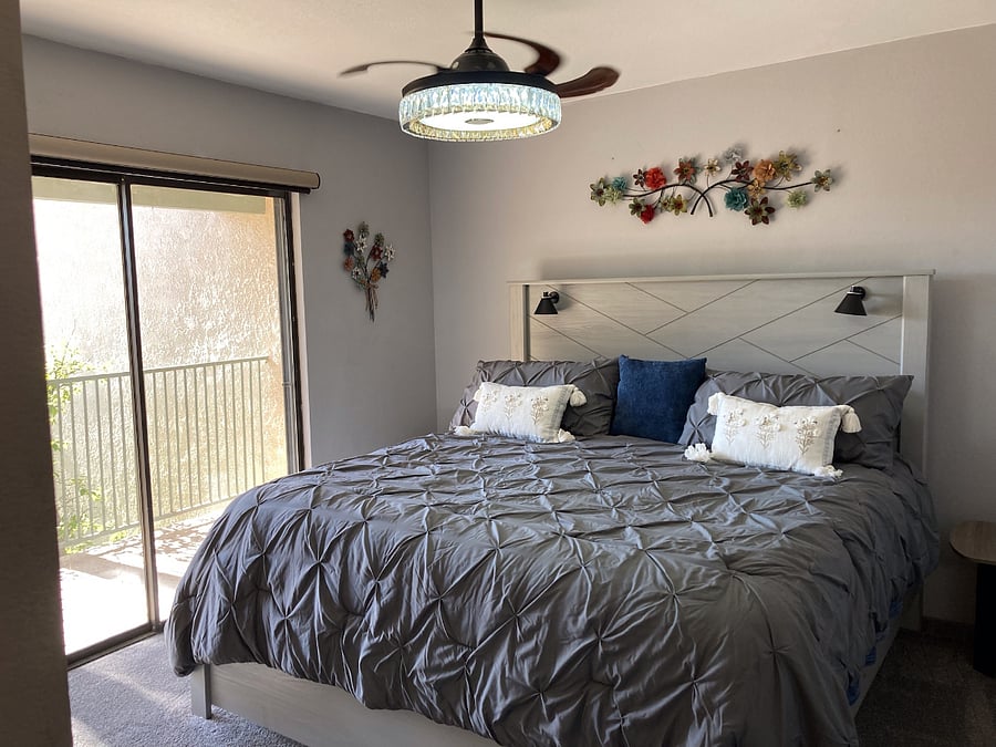 King Bed with walk-in closet and private balcony with chairs