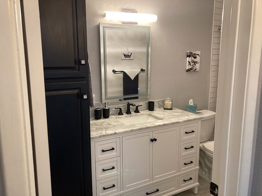 Master bath with large walk-in shower and full length cupboard