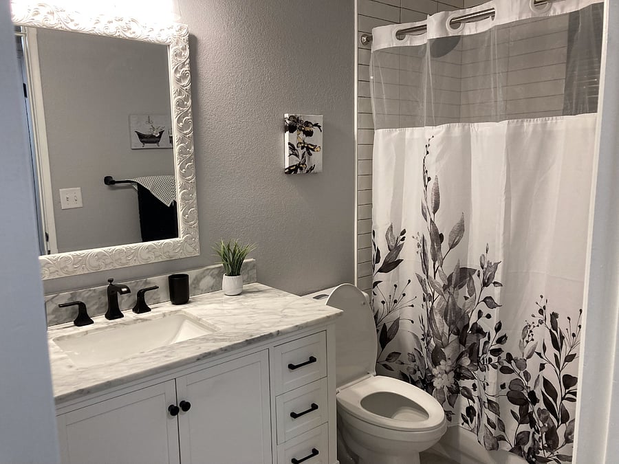 Guest bathroom with shower and bathtub 