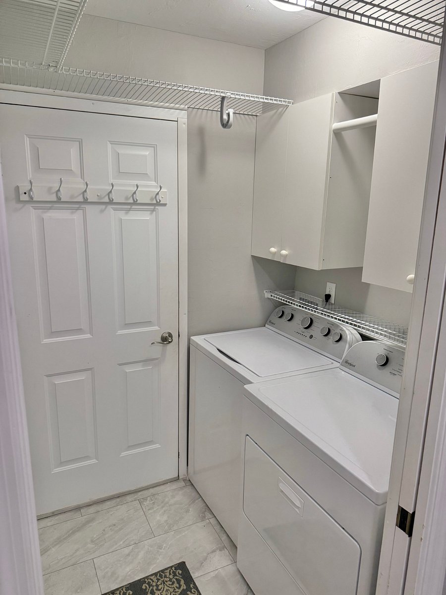 Entrance to the garage. Washer and Dryer