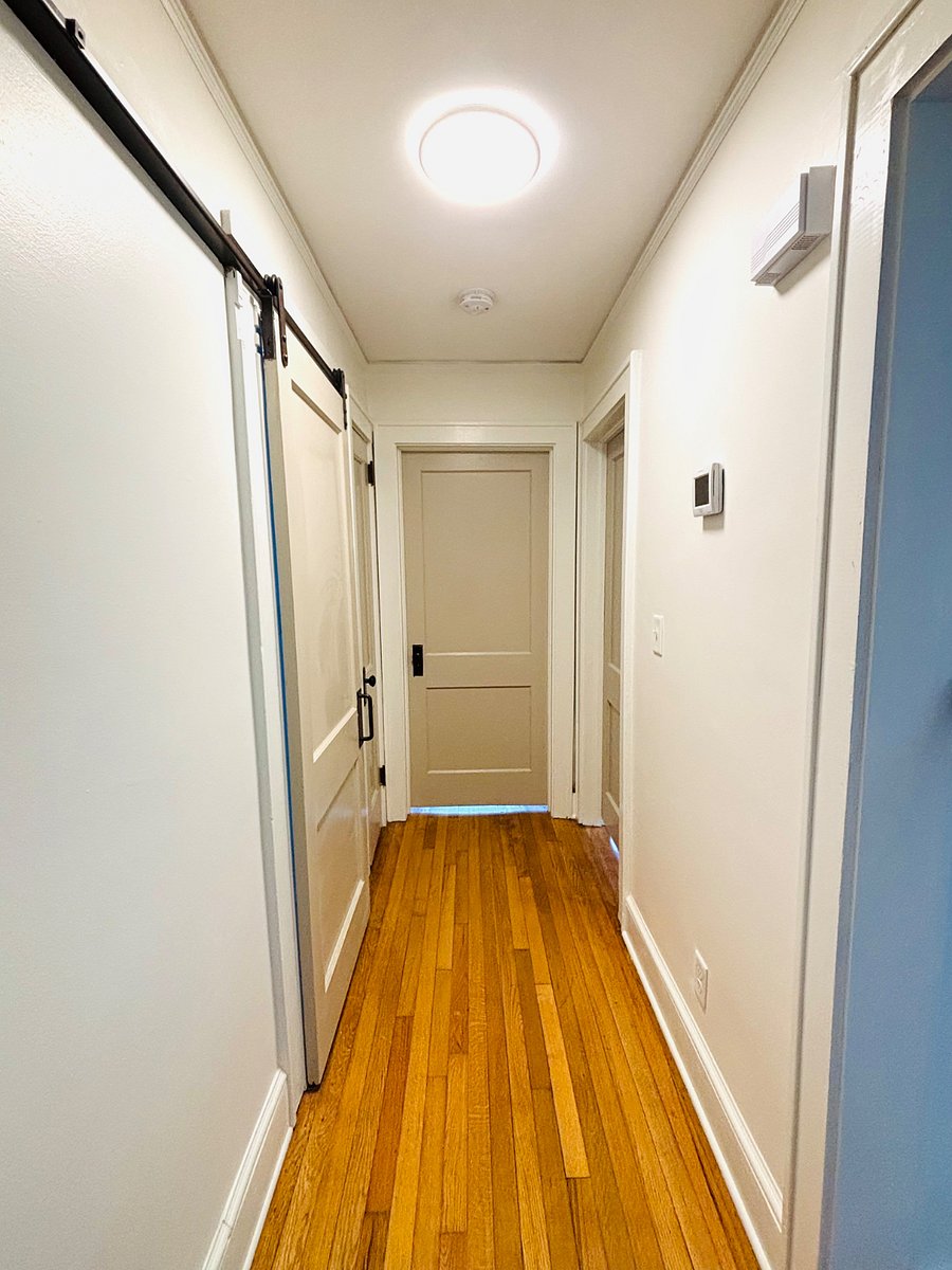 First floor hallway leading to bedrooms and bathroom