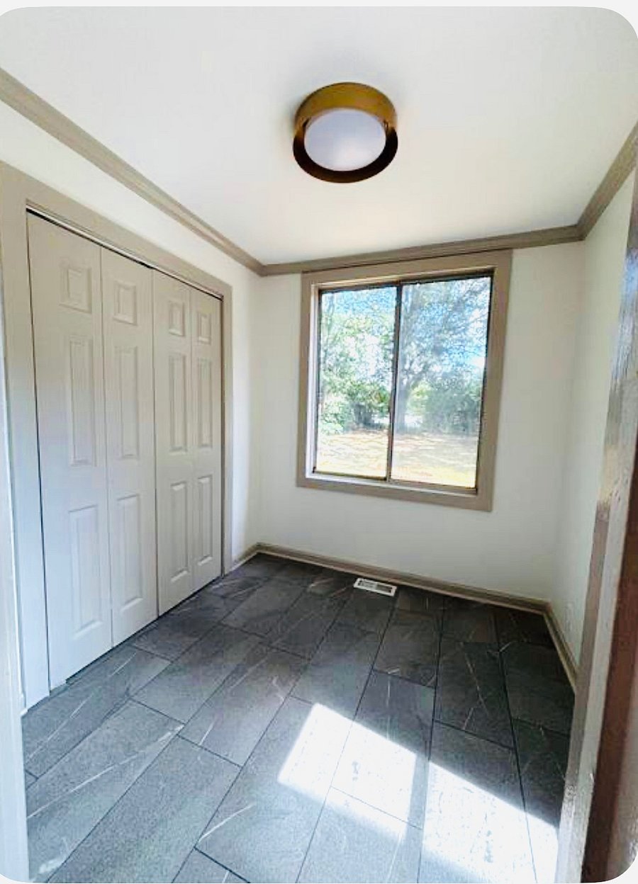 Mudroom off the kitchen leading to the deck. Perfect for hang drying laundry