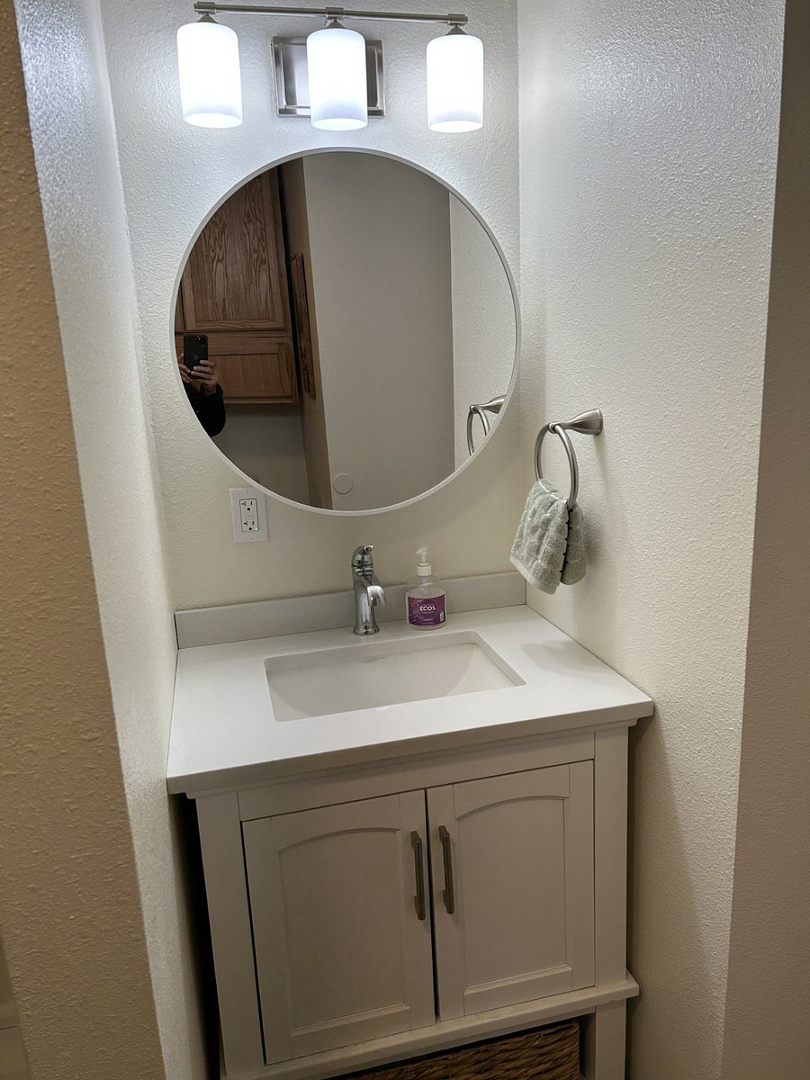 Medicine cabinet behind mirror