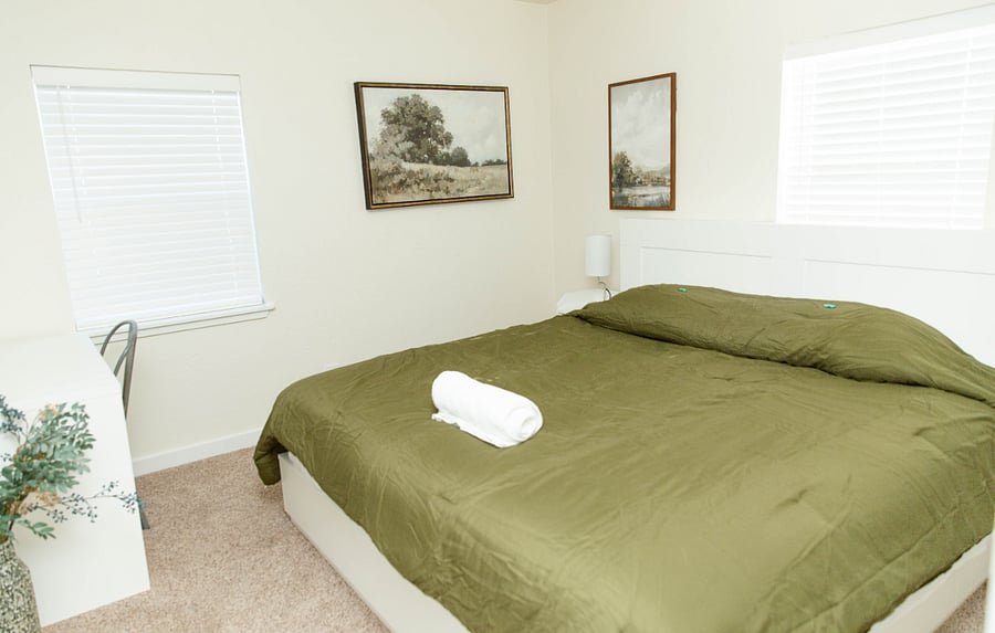 King bedroom with door to bathroom