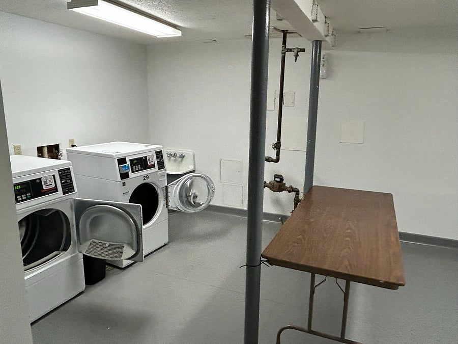 On-site laundry room located in basement of condo 