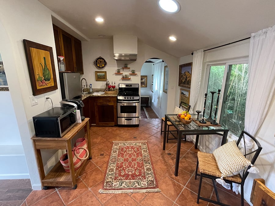 Clean and tidy kitchen with sitting area