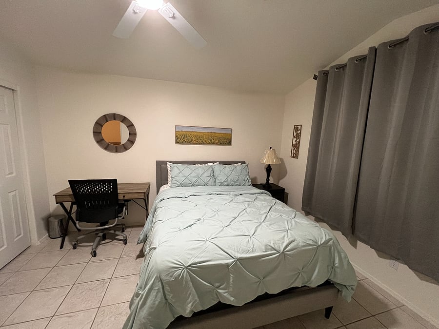 Bedroom with Queen Size Bed and desk area