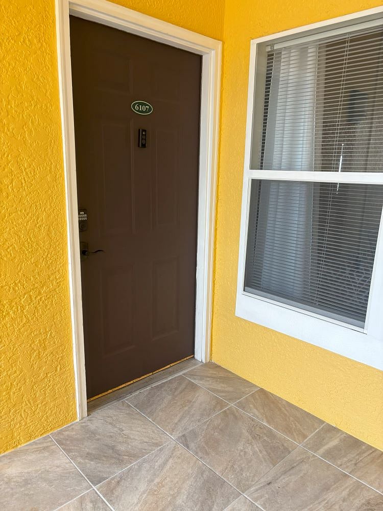 Exterior entrance door equipped with Ring camera and coded door lock
