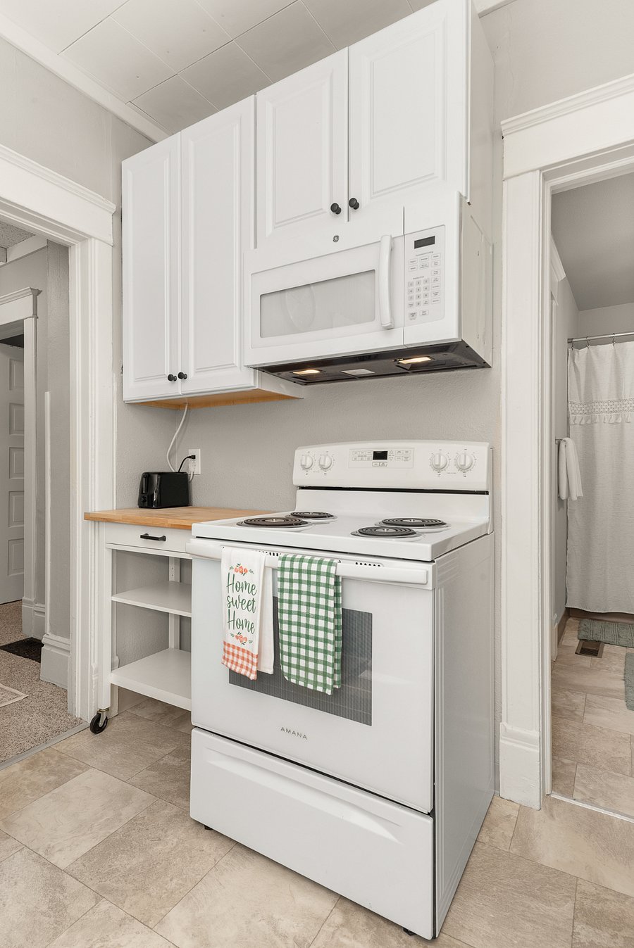 oven & stove top; large microwave; rolling kitchen island & toaster