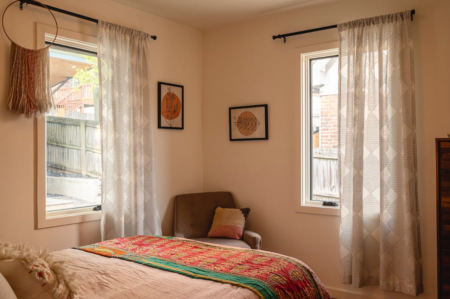 Main bedroom with dresser and queen bed